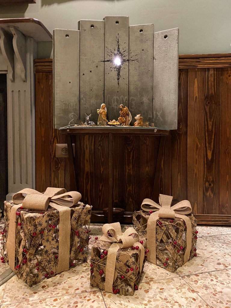 Banksy's Scar of Bethlehem Nativity scene with three presents 2019. Image copyright GraffitiStreet