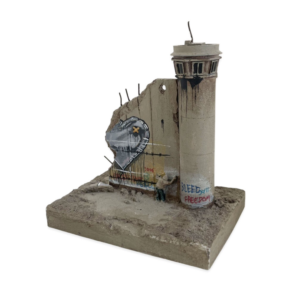 Banksy Love Hurts Walled Off Hotel sculpture with wounded silver heart balloon