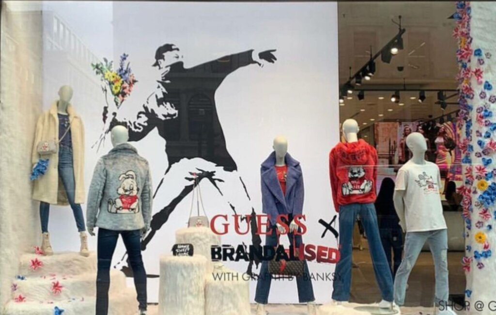 Banksy Accuses GUESS of Stealing his Artwork Designs and Encourages All Shoplifters to go Steal from the Clothes Range, London 2022