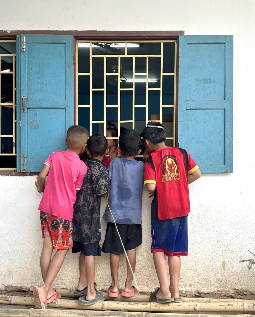 children reading at Ma Led Phan Library in Laos