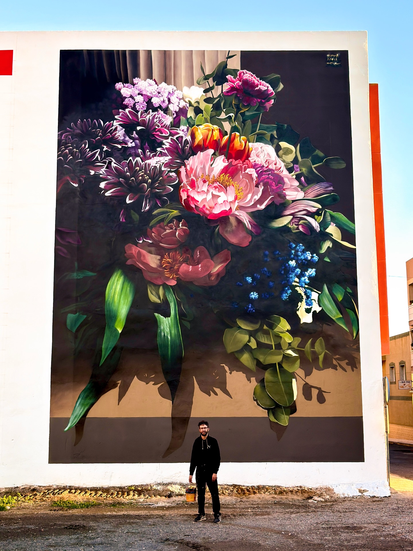 Full view of Brea Acuadros mural Vicar showing floral still life painting
