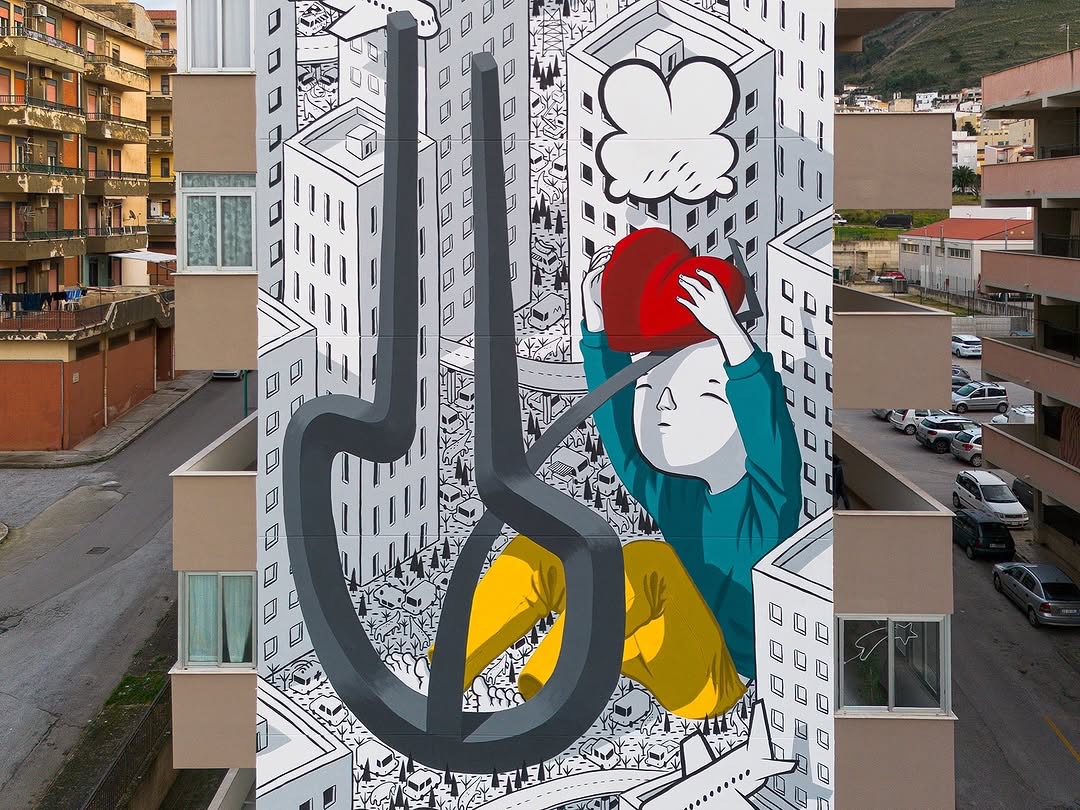 Detail of the Millo mural in Alcamo showing heart and urban architecture