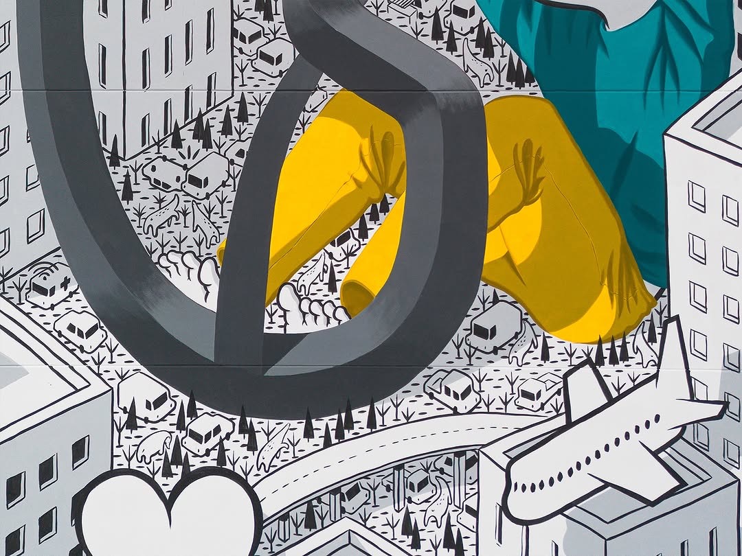 Detail of the Millo mural in Alcamo showing heart and urban architecture

