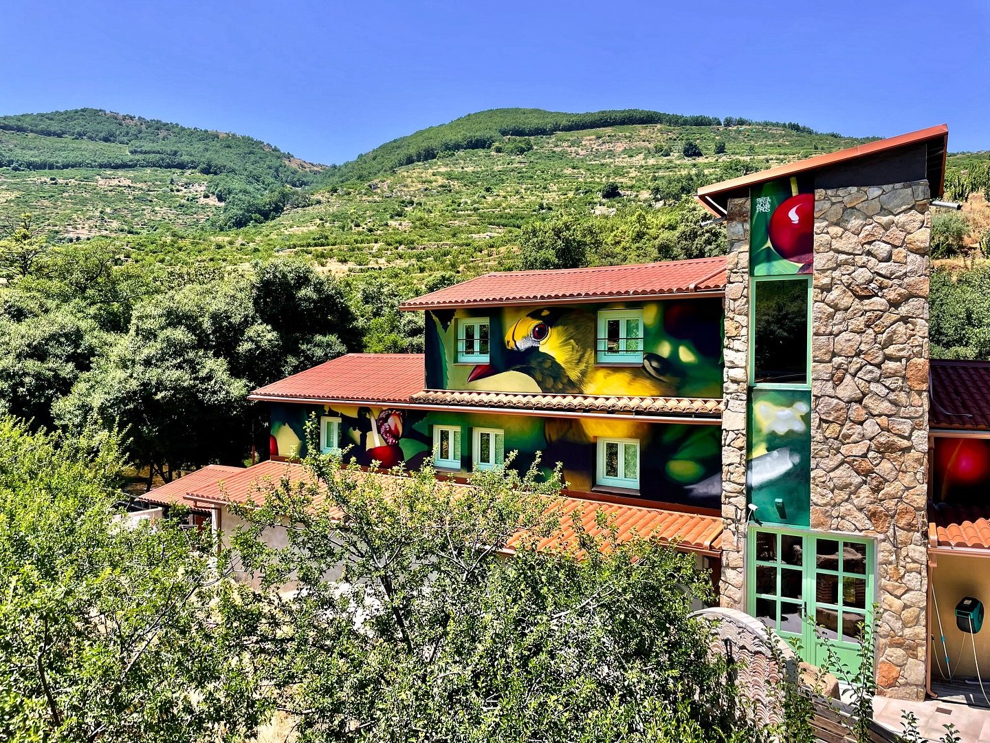Brea Acuadros mural exterior view in Valle del Jerte rural landscape