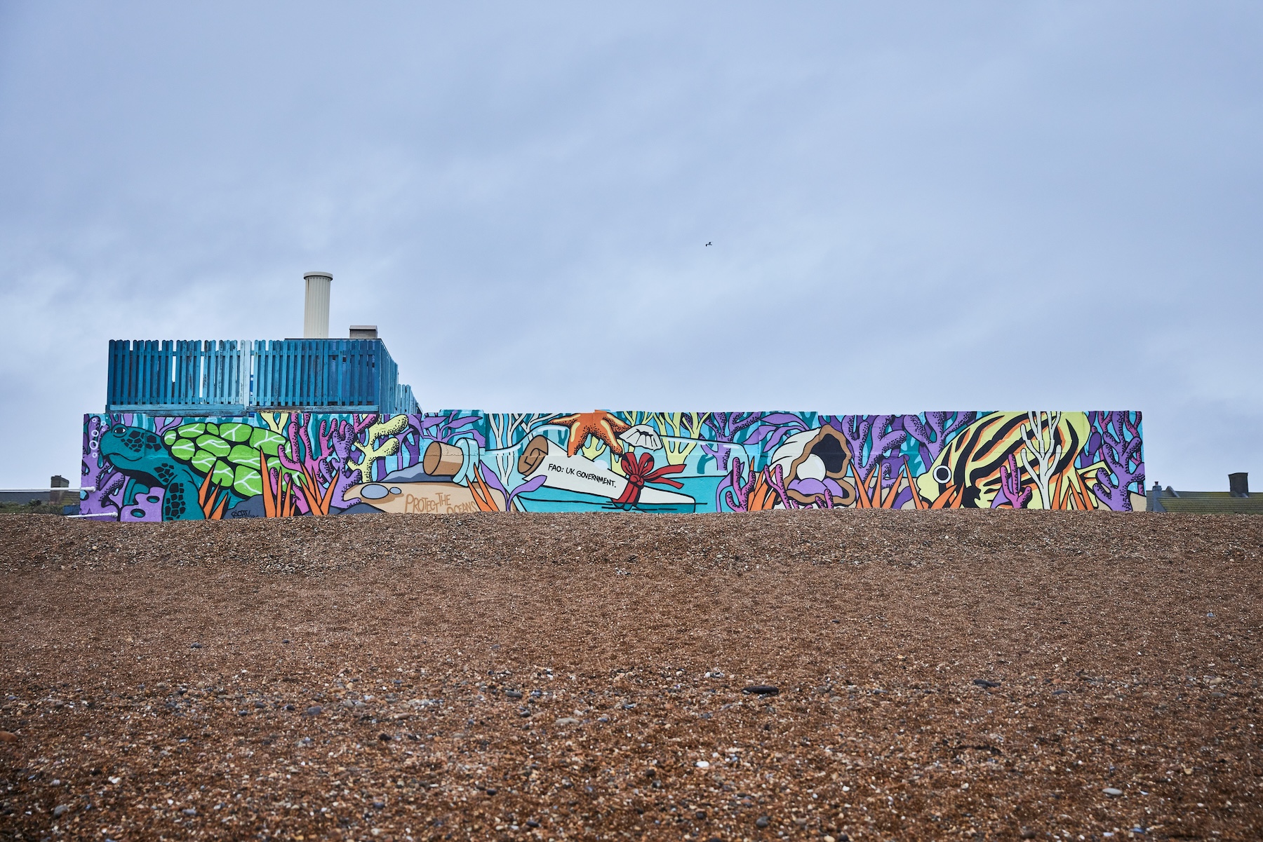 Ocean protection mural by artist Richt painted on a coastal wall