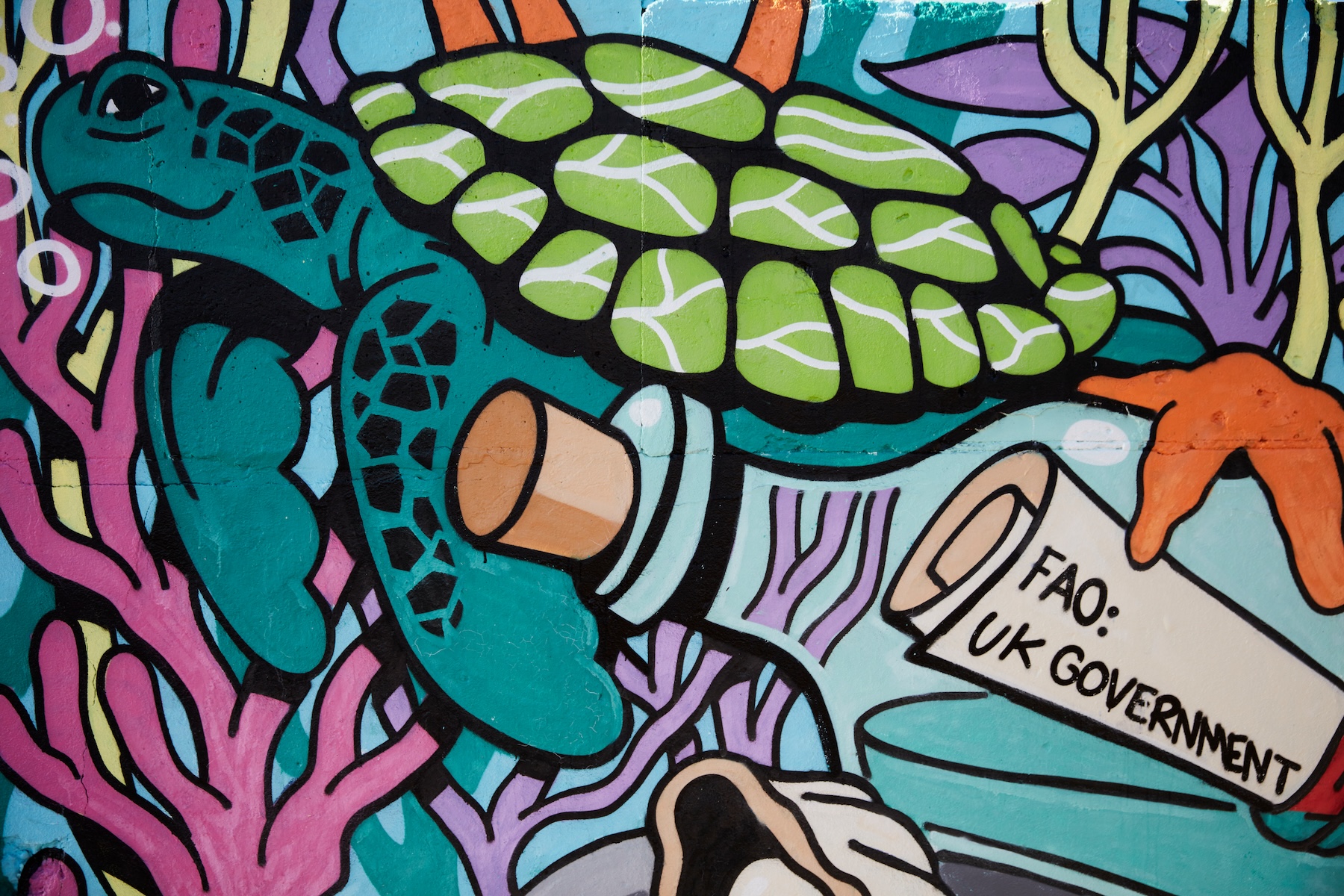 Close-up of the message in a bottle in Richt’s High Seas Treaty mural, calling on the UK government to sign the treaty into law.