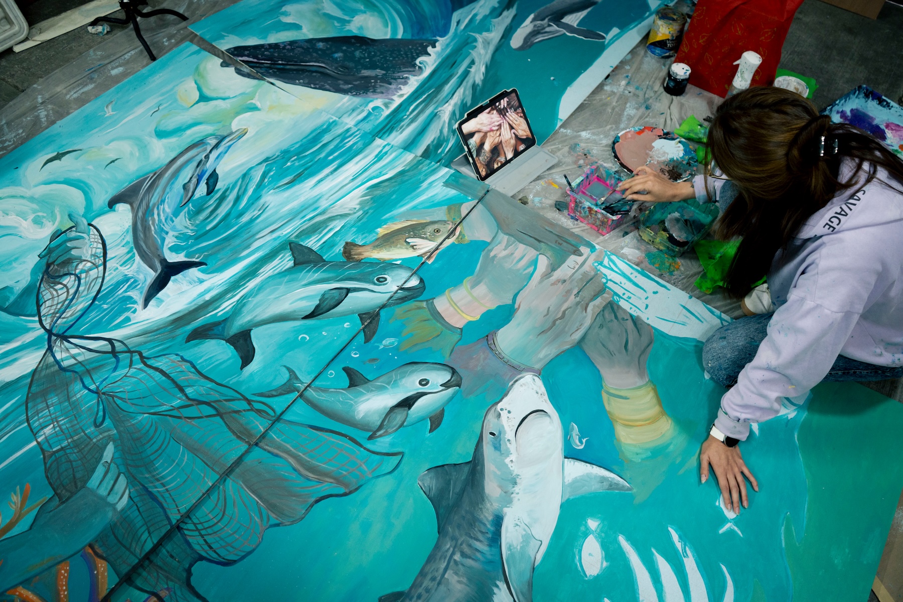 Artists painting murals