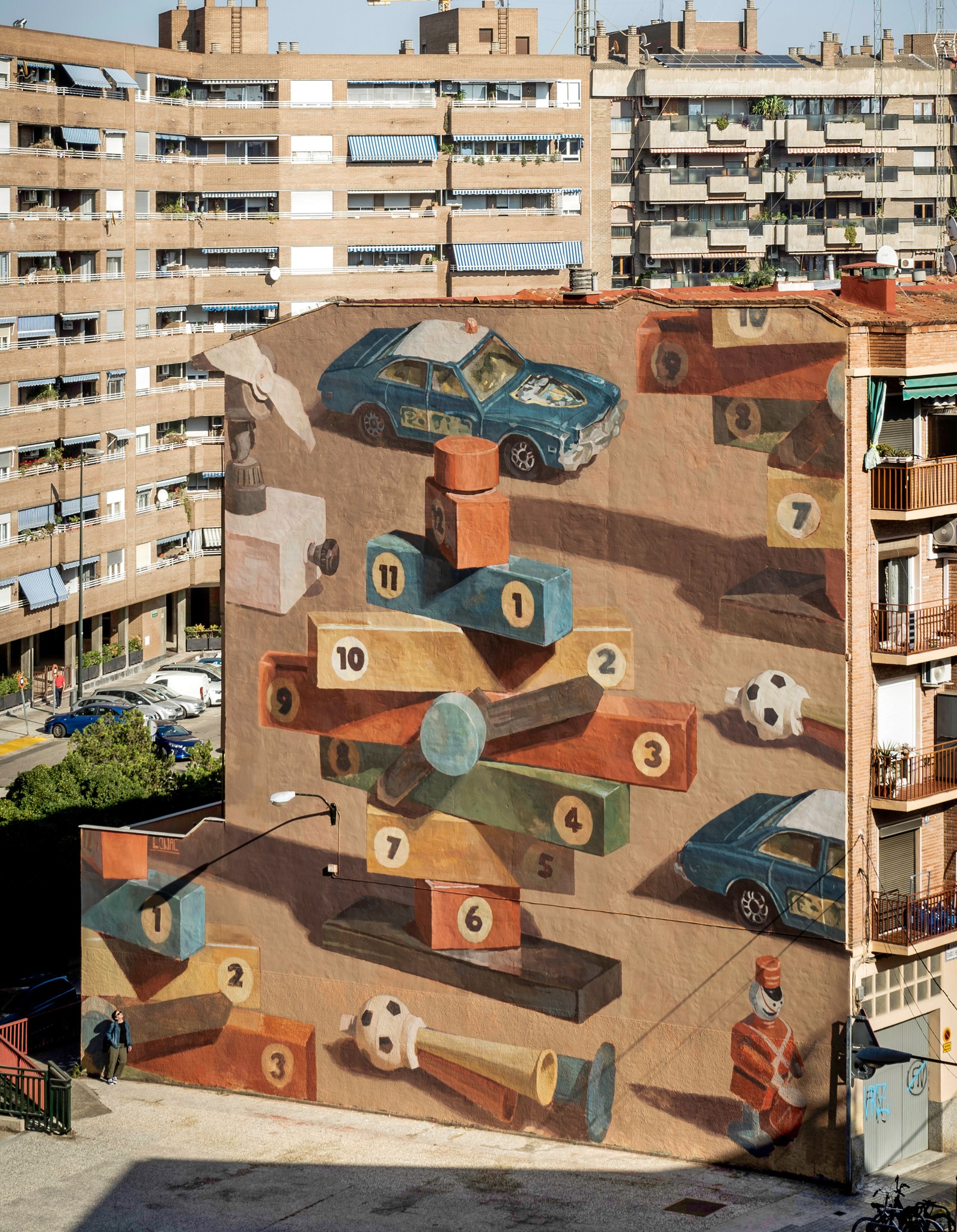 Playground mural by Lonac in Zaragoza created for ASALTO Festival, located between a police station and a school