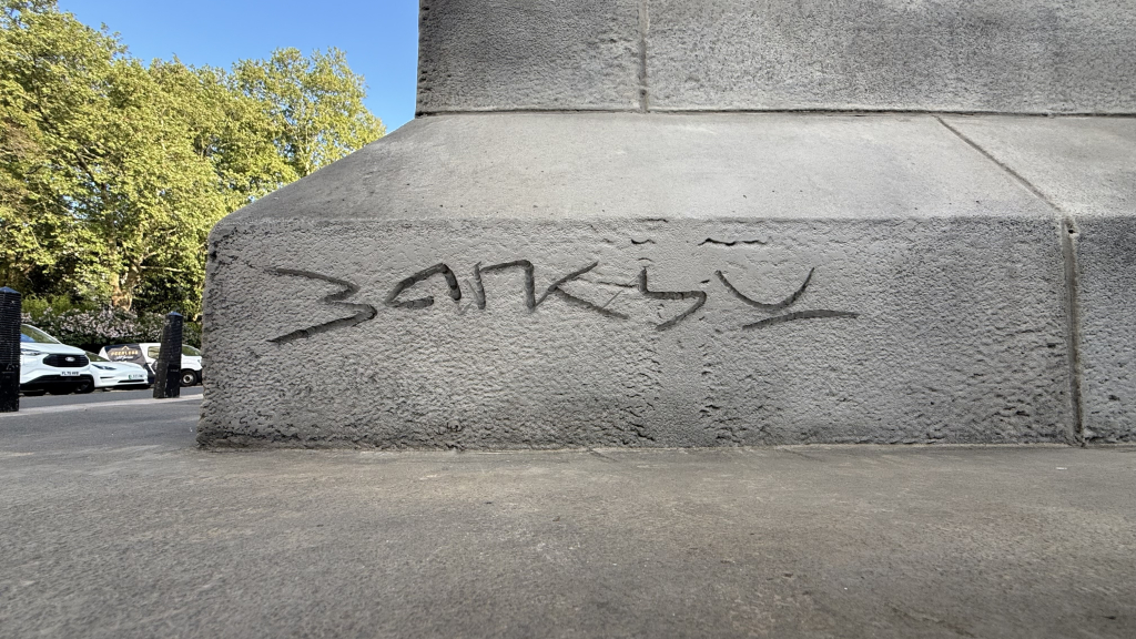 Banksy signature engraved on back of plinth Waterloo Place London 2026