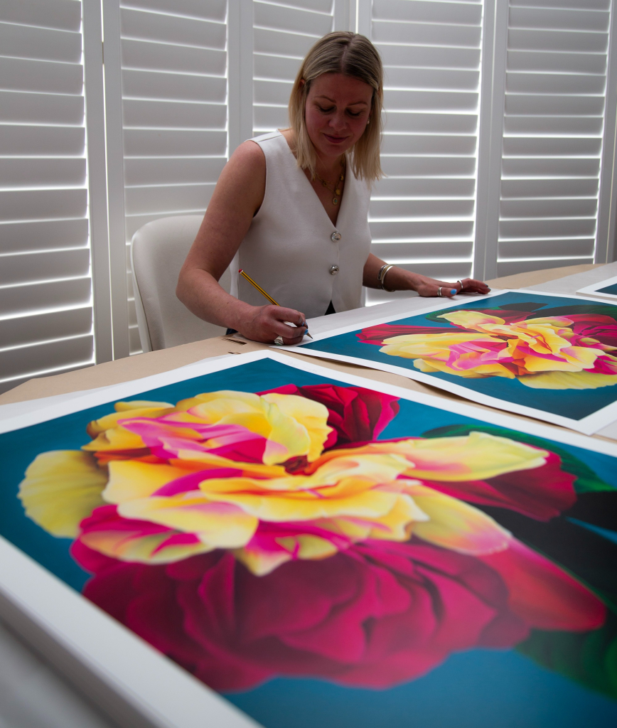 Sophie Mess signing Nebula Rose limited edition prints