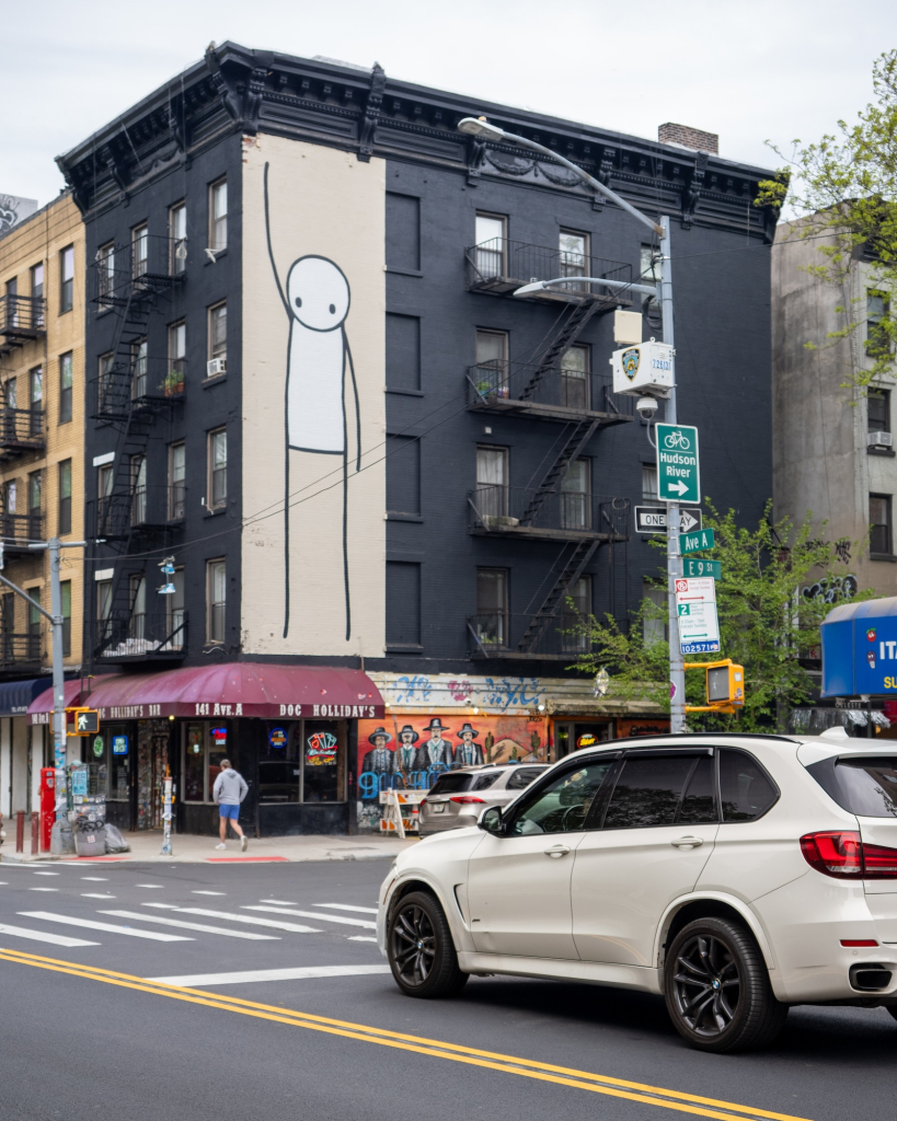 STIK Liberty mural New York street perspective
