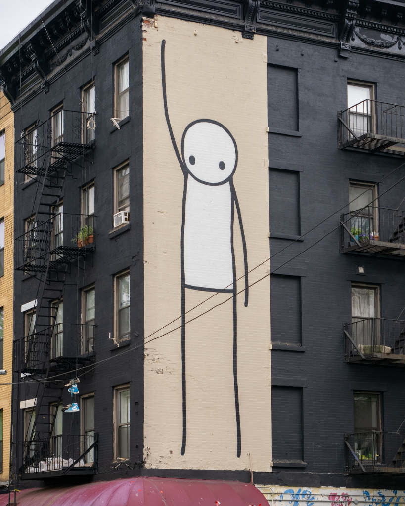 STIK Liberty mural close-up black painted facade